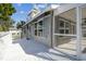 Large deck featuring glass enclosed porch and awnings for shade at 3476 Tidewater Dr, Weeki Wachee, FL 34607