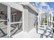 Rear exterior showcasing stairs to the rooftop viewing deck, and a screened porch of this coastal property at 3476 Tidewater Dr, Weeki Wachee, FL 34607