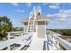 Exterior showcasing stairs to the rooftop viewing deck, and the home of this coastal property at 3476 Tidewater Dr, Weeki Wachee, FL 34607