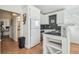 Coastal kitchen featuring white cabinetry, stainless steel appliances, and tile countertops at 3476 Tidewater Dr, Weeki Wachee, FL 34607