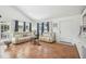Inviting living room with tile floors, white walls and coastal decor at 3476 Tidewater Dr, Weeki Wachee, FL 34607