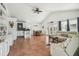 Bright, open-concept living area with tile floors, high ceilings, and ample natural light at 3476 Tidewater Dr, Weeki Wachee, FL 34607