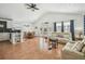 Bright, open-concept living area with tile floors, high ceilings, and ample natural light at 3476 Tidewater Dr, Weeki Wachee, FL 34607