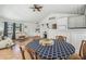 Bright open-concept living and dining area with white walls and coastal decor at 3476 Tidewater Dr, Weeki Wachee, FL 34607