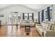 Bright living room with tile floors, vaulted ceilings, and comfortable seating at 3476 Tidewater Dr, Weeki Wachee, FL 34607