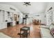 Open-concept living space with white cabinetry, and a dining area at 3476 Tidewater Dr, Weeki Wachee, FL 34607
