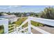 Rooftop viewpoint showcasing a neighborhood view surrounded by lush greenery, and blue skies at 3476 Tidewater Dr, Weeki Wachee, FL 34607