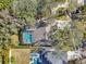 Aerial view showing home, pool, and surrounding neighborhood at 363 Sanctuary Dr, Crystal Beach, FL 34681