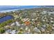 Aerial view showcasing the home's location near the water at 363 Sanctuary Dr, Crystal Beach, FL 34681
