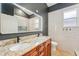Modern bathroom with double sinks, granite countertops, and updated fixtures at 363 Sanctuary Dr, Crystal Beach, FL 34681