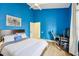 Comfortable bedroom with workspace and blue walls at 363 Sanctuary Dr, Crystal Beach, FL 34681