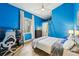 Cozy bedroom with built-in workspace and blue walls at 363 Sanctuary Dr, Crystal Beach, FL 34681