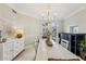 Bright dining room with white table and chairs at 363 Sanctuary Dr, Crystal Beach, FL 34681