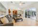 Open Gathering room showcasing a comfortable sectional sofa and access to the pool area at 363 Sanctuary Dr, Crystal Beach, FL 34681