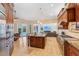 Spacious kitchen with island, stainless steel appliances and view into Gathering room at 363 Sanctuary Dr, Crystal Beach, FL 34681