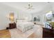 Relaxing main bedroom with hardwood floors, ensuite bathroom and ample natural light at 363 Sanctuary Dr, Crystal Beach, FL 34681
