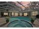 Relaxing pool and spa area with covered lanai at 363 Sanctuary Dr, Crystal Beach, FL 34681