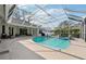 Screened-in pool and spa area at 363 Sanctuary Dr, Crystal Beach, FL 34681