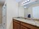 Bathroom with a double vanity, granite countertop, and a large mirror at 37804 Prairie Rose Loop, Zephyrhills, FL 33542