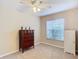 Bright bedroom with ceiling fan, large closet, and window coverings at 37804 Prairie Rose Loop, Zephyrhills, FL 33542