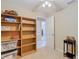 Bedroom with built-in shelving and window at 37804 Prairie Rose Loop, Zephyrhills, FL 33542