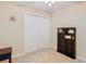 Bedroom with double door closet and bookshelf at 37804 Prairie Rose Loop, Zephyrhills, FL 33542