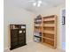 Bedroom with two bookshelves and window at 37804 Prairie Rose Loop, Zephyrhills, FL 33542
