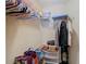 Shelved closet with hanging rods and ample storage space at 37804 Prairie Rose Loop, Zephyrhills, FL 33542