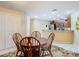 Charming dining area with round table and chairs near kitchen at 37804 Prairie Rose Loop, Zephyrhills, FL 33542