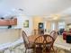 Bright dining area with a round table and four chairs near kitchen at 37804 Prairie Rose Loop, Zephyrhills, FL 33542