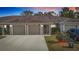 Triple-unit building with attached garages and landscaping at 37804 Prairie Rose Loop, Zephyrhills, FL 33542