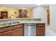Kitchen with granite countertop, stainless steel dishwasher and view of bathroom at 37804 Prairie Rose Loop, Zephyrhills, FL 33542