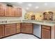 Modern kitchen with stainless steel appliances and granite countertops at 37804 Prairie Rose Loop, Zephyrhills, FL 33542