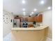 Modern kitchen featuring granite countertops and stainless steel appliances at 37804 Prairie Rose Loop, Zephyrhills, FL 33542