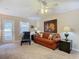 Living Room with couch, large artwork, and access to patio at 37804 Prairie Rose Loop, Zephyrhills, FL 33542