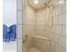 Large tiled shower with built-in seat and grab bar at 37804 Prairie Rose Loop, Zephyrhills, FL 33542