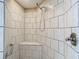 Walk-in shower with tiled walls and built-in seat at 37804 Prairie Rose Loop, Zephyrhills, FL 33542
