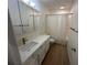 Updated bathroom with white vanity, quartz countertop, and new fixtures at 4511 S Oak Dr # R12, Tampa, FL 33611