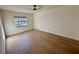 Well-lit bedroom with wood-look floors and a window at 4511 S Oak Dr # R12, Tampa, FL 33611