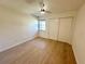 Spacious bedroom with wood-look floors and ceiling fan at 4511 S Oak Dr # R12, Tampa, FL 33611