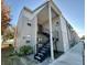Exterior view of a light-colored building with stairs and a walkway at 4511 S Oak Dr # R12, Tampa, FL 33611