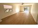 Bright living room with wood-look floors and sliding glass doors leading to a patio at 4511 S Oak Dr # R12, Tampa, FL 33611