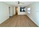 Spacious living room with wood-look floors and views into the kitchen at 4511 S Oak Dr # R12, Tampa, FL 33611