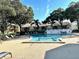 Community swimming pool with lounge chairs at 4511 S Oak Dr # R12, Tampa, FL 33611