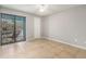 The bedroom has a neutral color palette, tile floors, and access to a private balcony at 455 Alt 19 S # 268, Palm Harbor, FL 34683