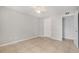 This bedroom features tile floors, a ceiling fan, and a walk-in closet at 455 Alt 19 S # 268, Palm Harbor, FL 34683