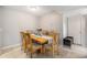 Inviting dining room with a wooden table and six chairs set on tile flooring, ready for gatherings at 455 Alt 19 S # 268, Palm Harbor, FL 34683