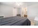 The large bedroom has a neutral color palette with access to an en-suite bathroom at 455 Alt 19 S # 268, Palm Harbor, FL 34683