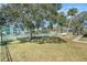 Well-maintained tennis courts with lush landscaping creating a perfect backdrop at 455 Alt 19 S # 268, Palm Harbor, FL 34683