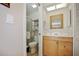 Light and airy bathroom with a toilet, sink, and shower at 460 Paula S Dr # 401, Dunedin, FL 34698